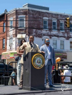 Speech by Senator Sharif Street. A man standing on a stage giving a speech in Philadelphia.